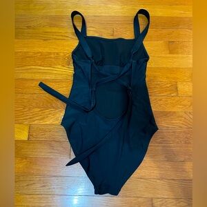 Black, low cut, back tie, one piece